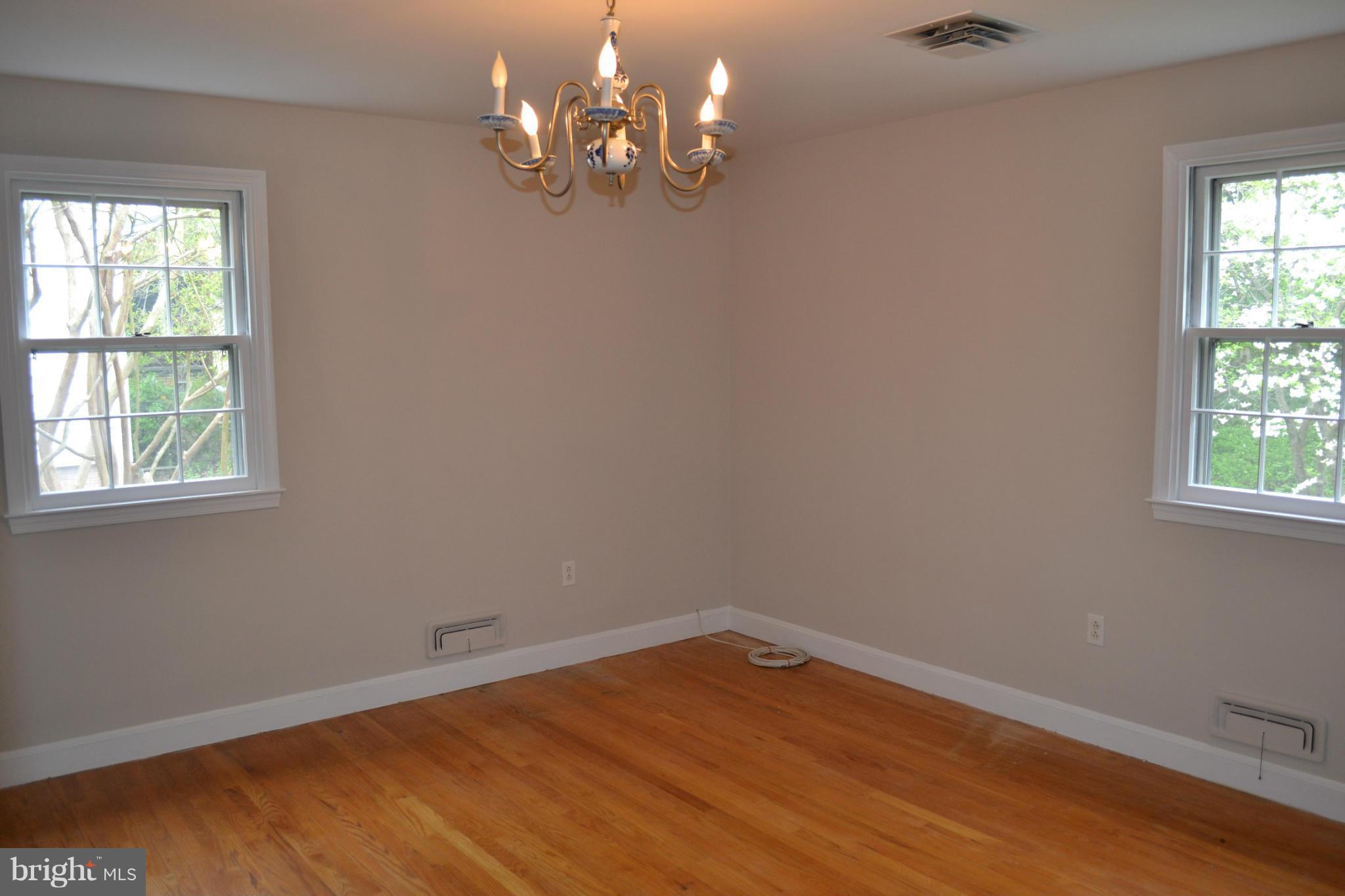 7911 Springway Road Baltimore, MD 21204 - Photo 14 of 30 wooden floor in an empty room with a window