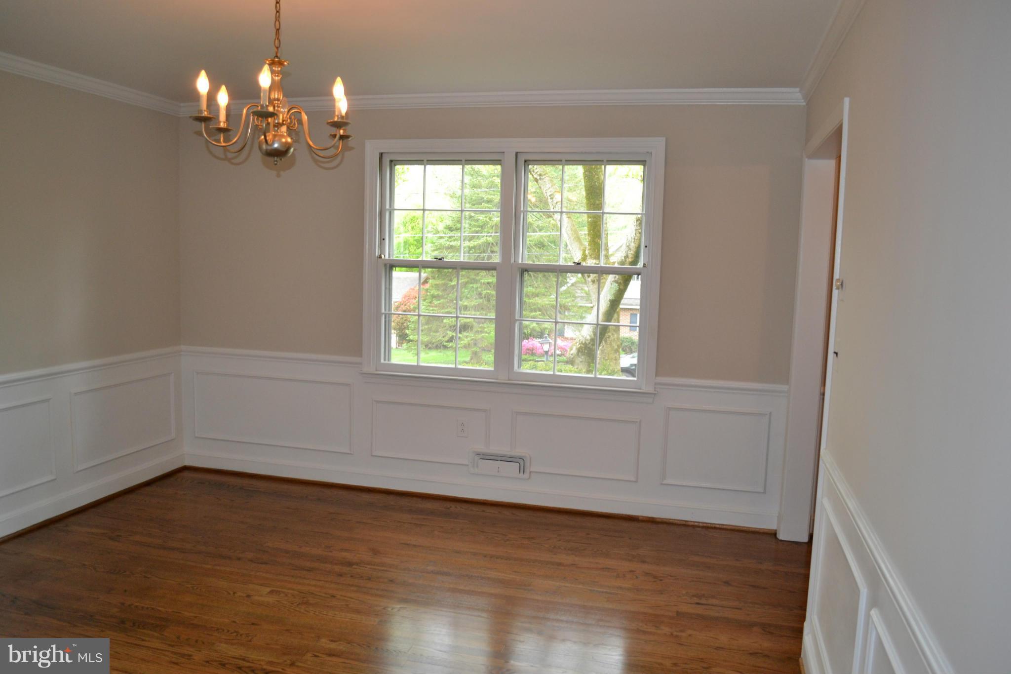 7911 Springway Road Baltimore, MD 21204 - Photo 3 of 30 wooden floor in an empty room with a window