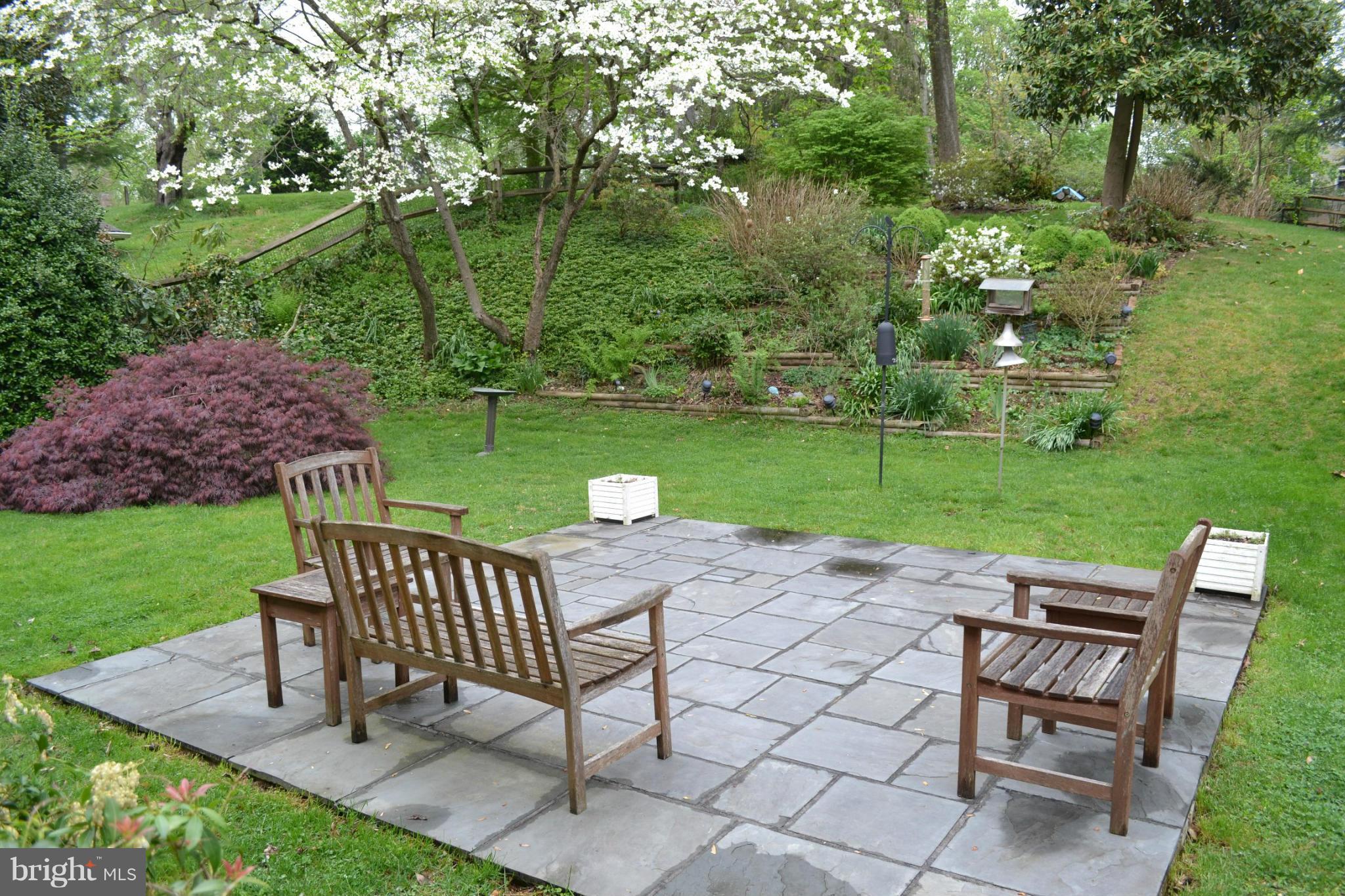 7911 Springway Road Baltimore, MD 21204 - Photo 22 of 30 a view of a chairs and table on the garden