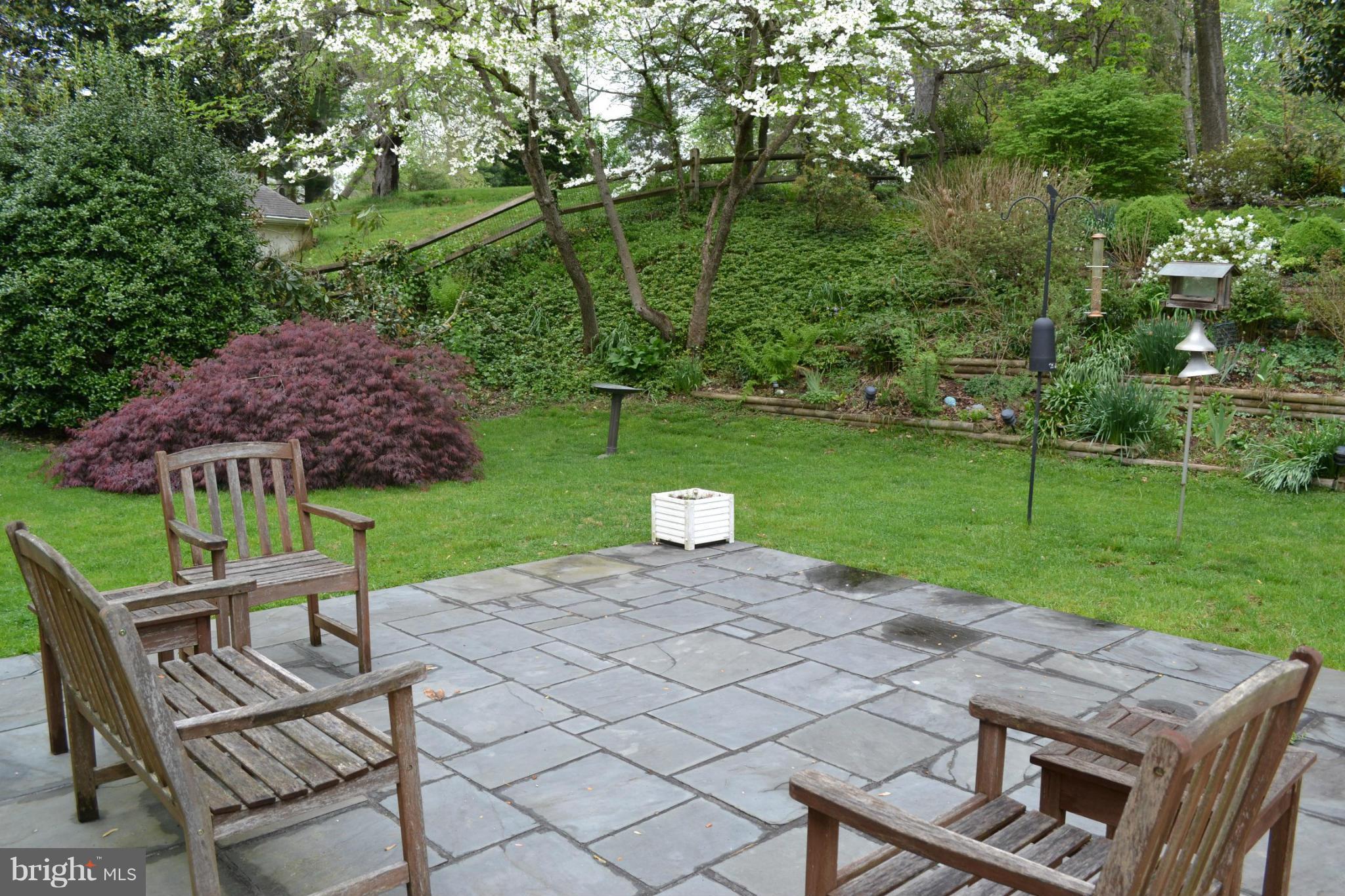 7911 Springway Road Baltimore, MD 21204 - Photo 23 of 30 a view of a chairs and table in backyard of the house
