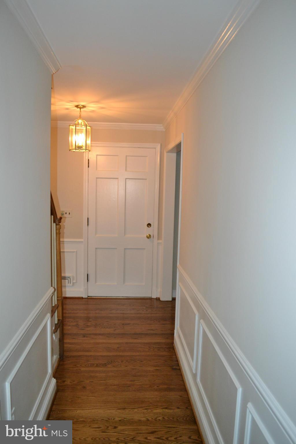 7911 Springway Road Baltimore, MD 21204 - Photo 4 of 30 a view of hallway with wooden floor