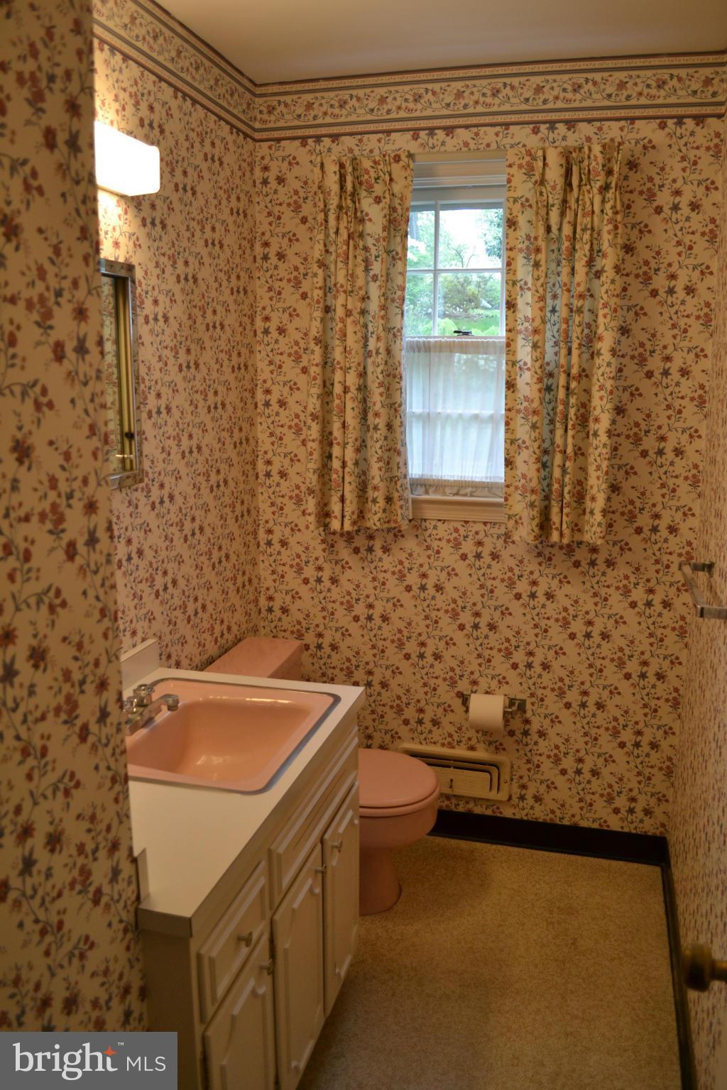 7911 Springway Road Baltimore, MD 21204 - Photo 5 of 30 a bathroom with a sink and a bathtub