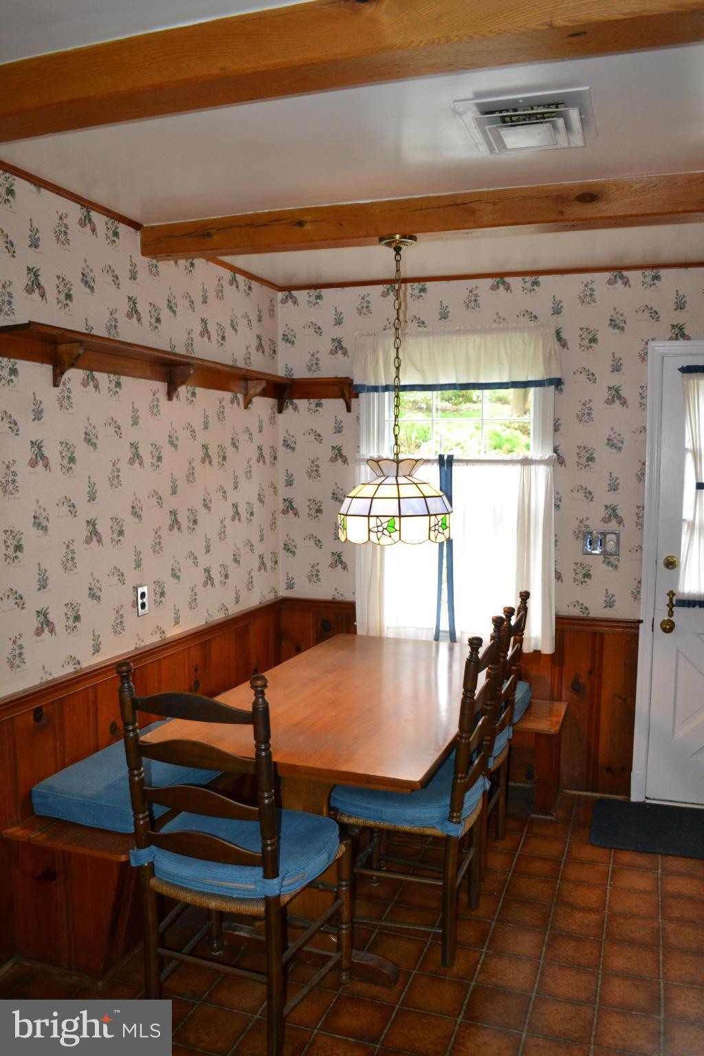 7911 Springway Road Baltimore, MD 21204 - Photo 7 of 30 a view of a dining room with furniture and a chandelier