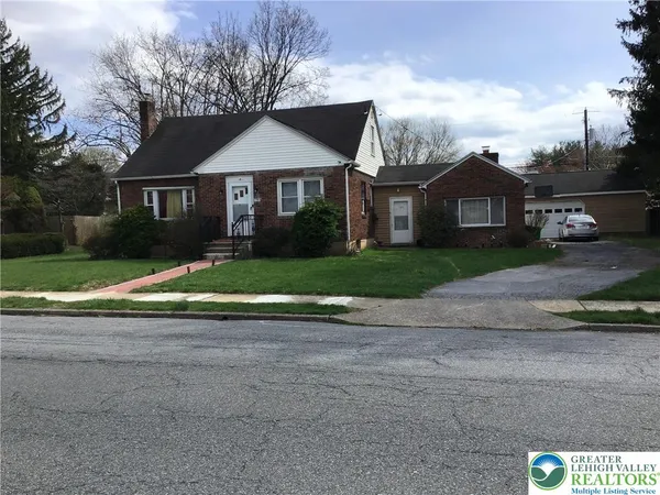 a view of house with yard