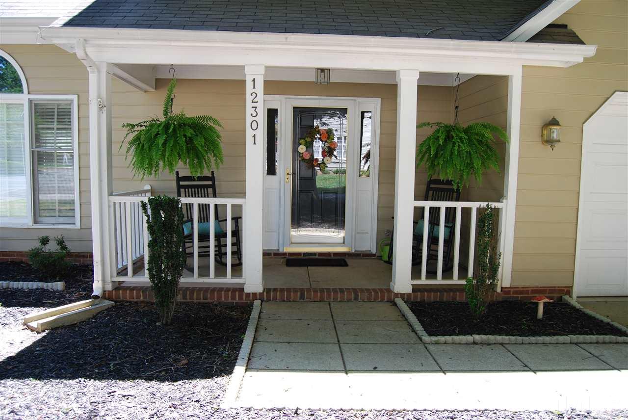 12301 Inglehurst Drive Raleigh, NC 27613 - Photo 2 of 23 a black and white house with a outdoor space