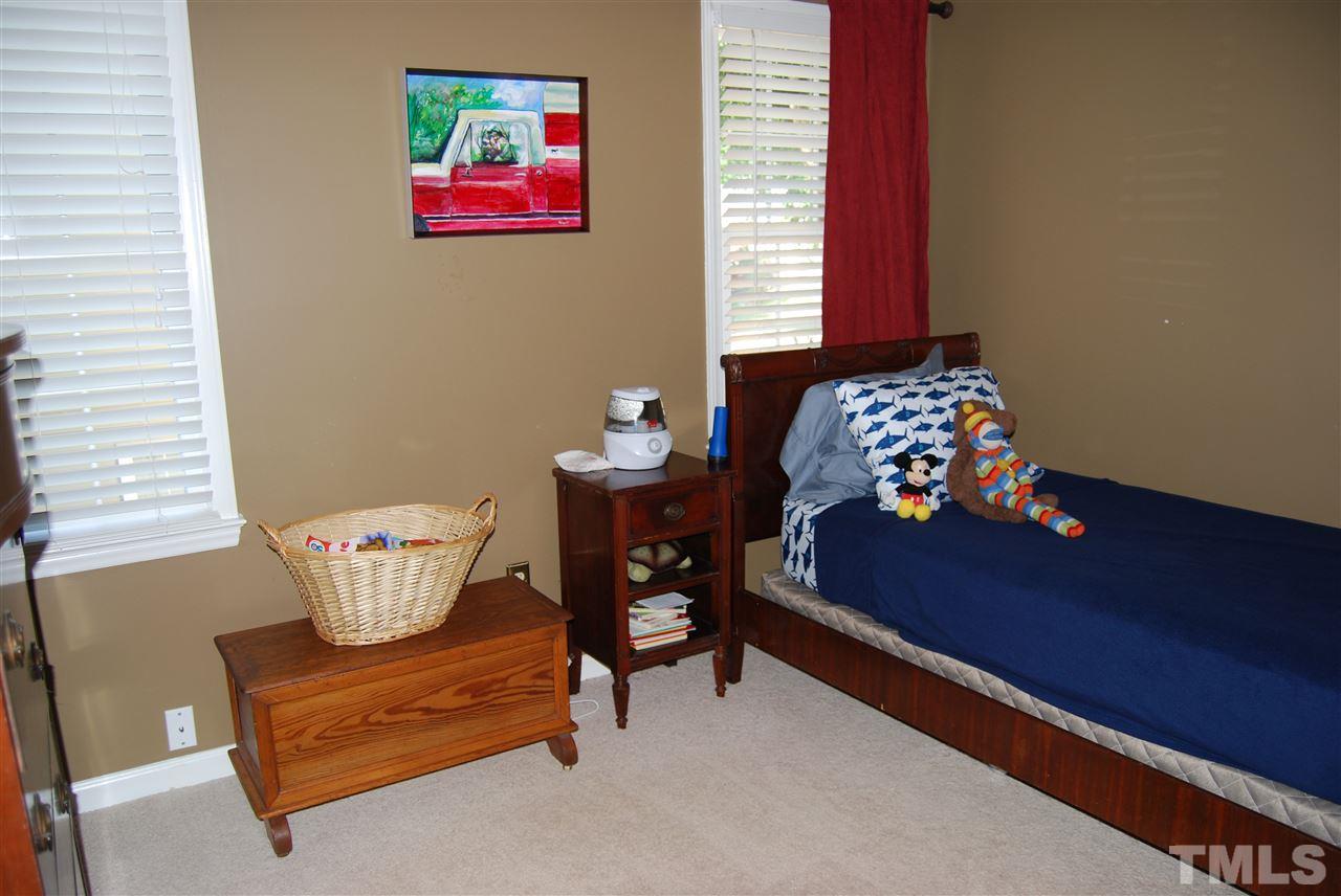 12301 Inglehurst Drive Raleigh, NC 27613 - Photo 19 of 23 a living room with furniture and a window