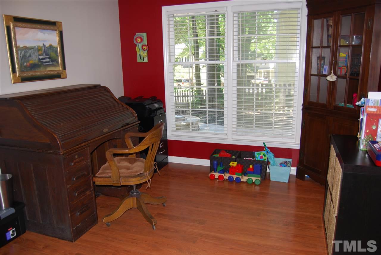 12301 Inglehurst Drive Raleigh, NC 27613 - Photo 9 of 23 a living room with furniture and a floor to ceiling window