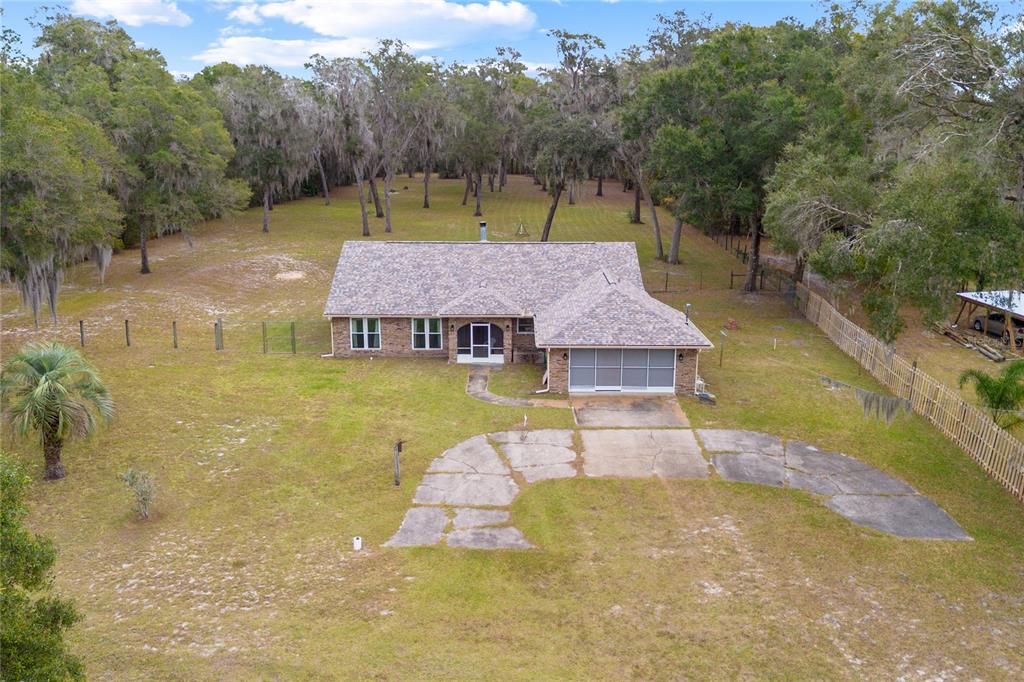 a view of a swimming pool with a yard