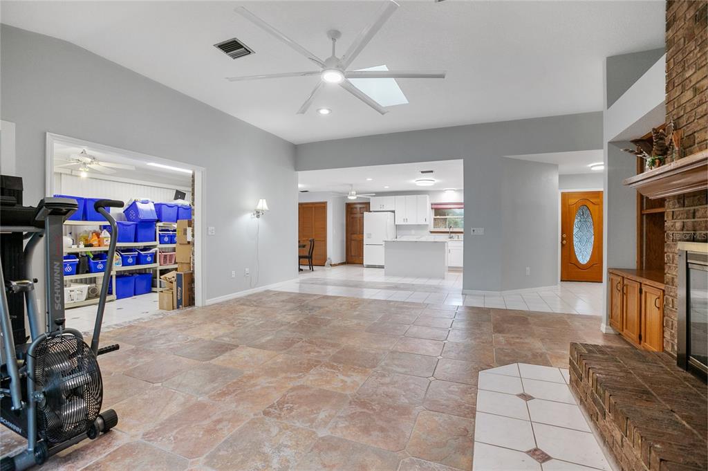 378 Glenwood Road DeLand, FL 32720 - Photo 11 of 38 a view of a livingroom with furniture and a flat screen tv