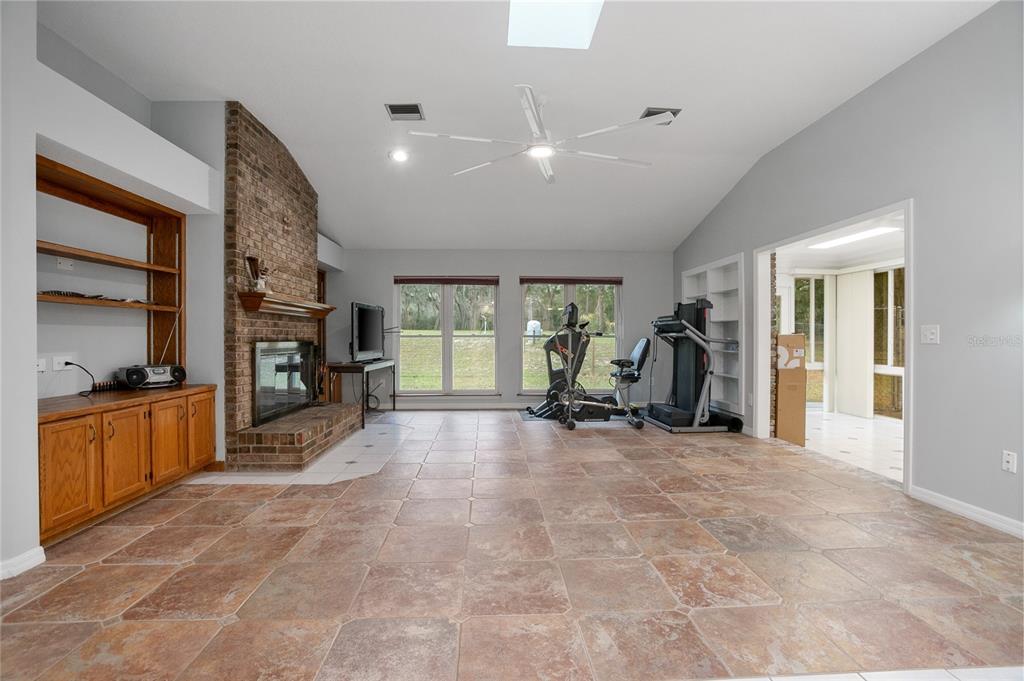 378 Glenwood Road DeLand, FL 32720 - Photo 12 of 38 a view of a livingroom with furniture and a large window