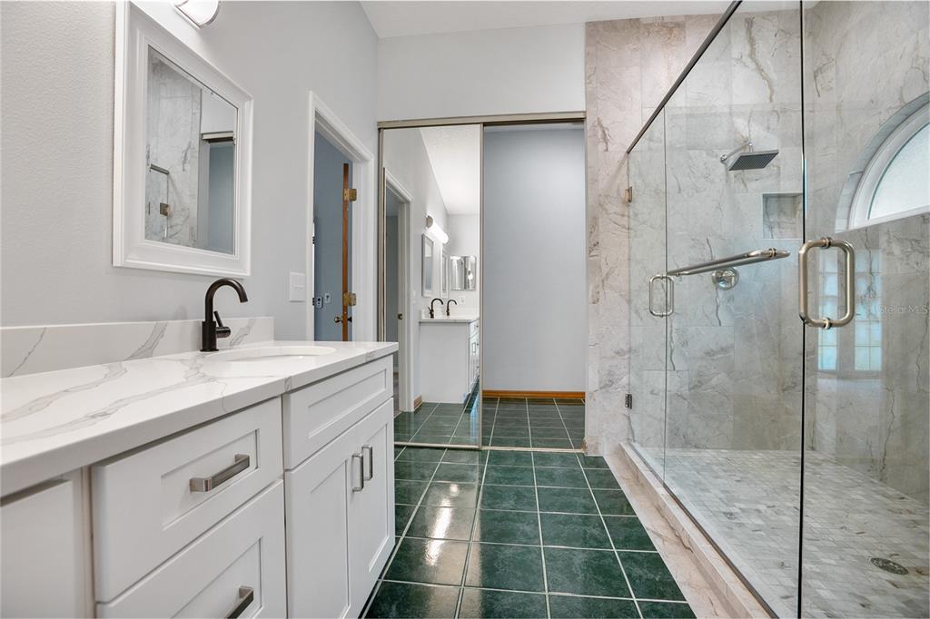 378 Glenwood Road DeLand, FL 32720 - Photo 16 of 38 a bathroom with a shower sink and mirror