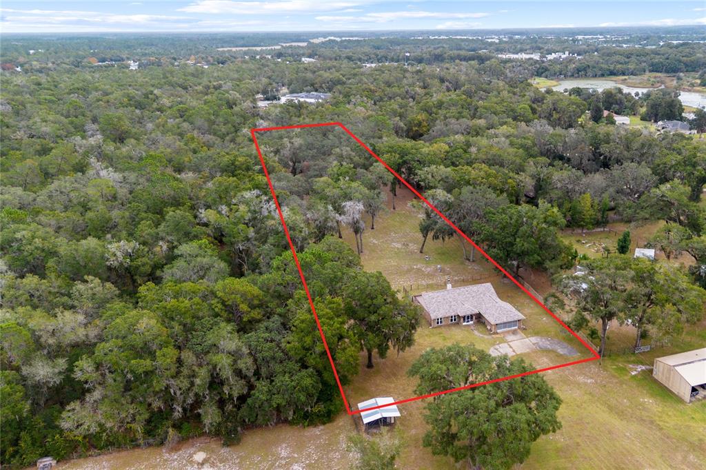 378 Glenwood Road DeLand, FL 32720 - Photo 2 of 38 an aerial view of a house with a yard