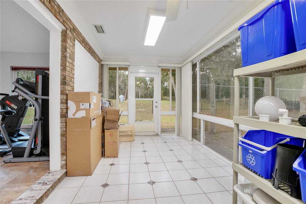 378 Glenwood Road DeLand, FL 32720 - Photo 23 of 38 a bedroom with a large bed and a large window