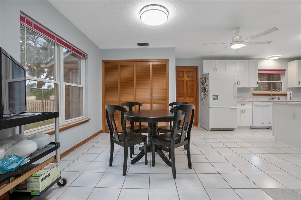 378 Glenwood Road DeLand, FL 32720 - Photo 10 of 38 a view of a dining room with furniture and chandelier