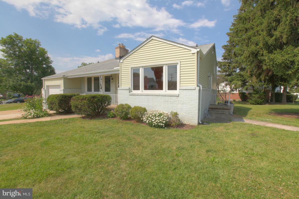 7514 Labyrinth Road Baltimore, MD 21208 - Photo 2 of 27 a front view of house with yard and green space