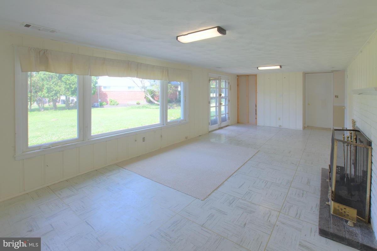 7514 Labyrinth Road Baltimore, MD 21208 - Photo 17 of 27 a view of an empty room with a window