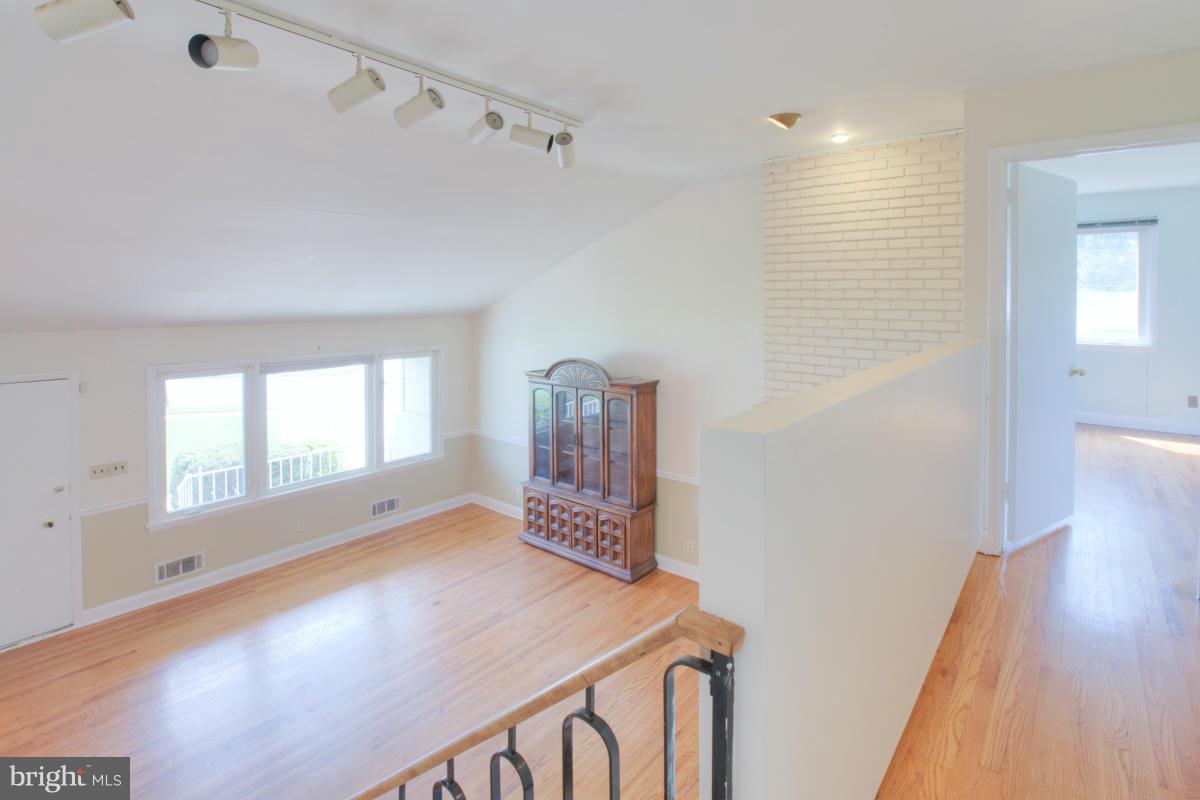 7514 Labyrinth Road Baltimore, MD 21208 - Photo 23 of 27 a view of a hallway with front door