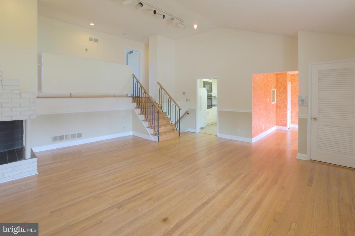 7514 Labyrinth Road Baltimore, MD 21208 - Photo 8 of 27 a view of empty room with wooden floor
