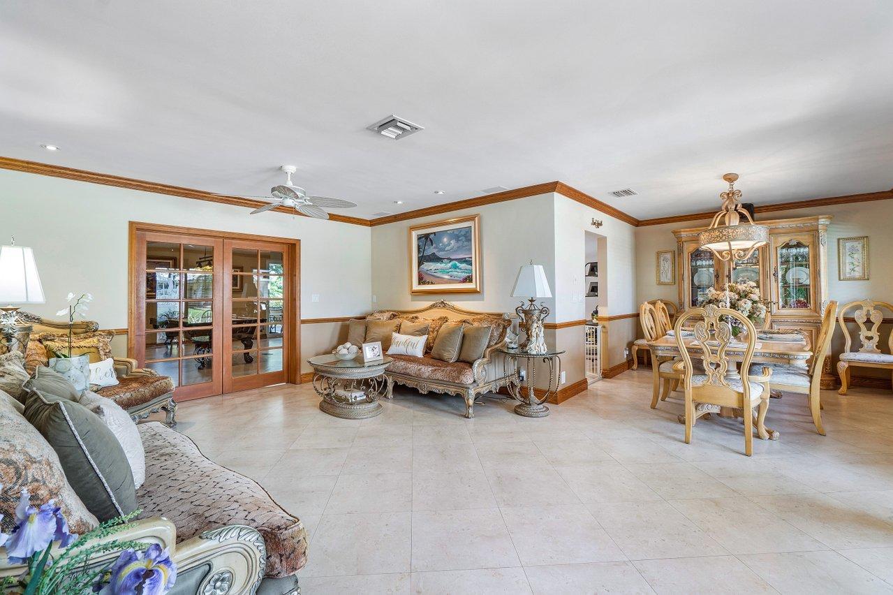1018 Southwest 14th Street Boca Raton, FL 33486 - Photo 7 of 33 a living room with furniture and a large window