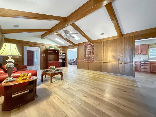 a view of a living room a kitchen and dining room