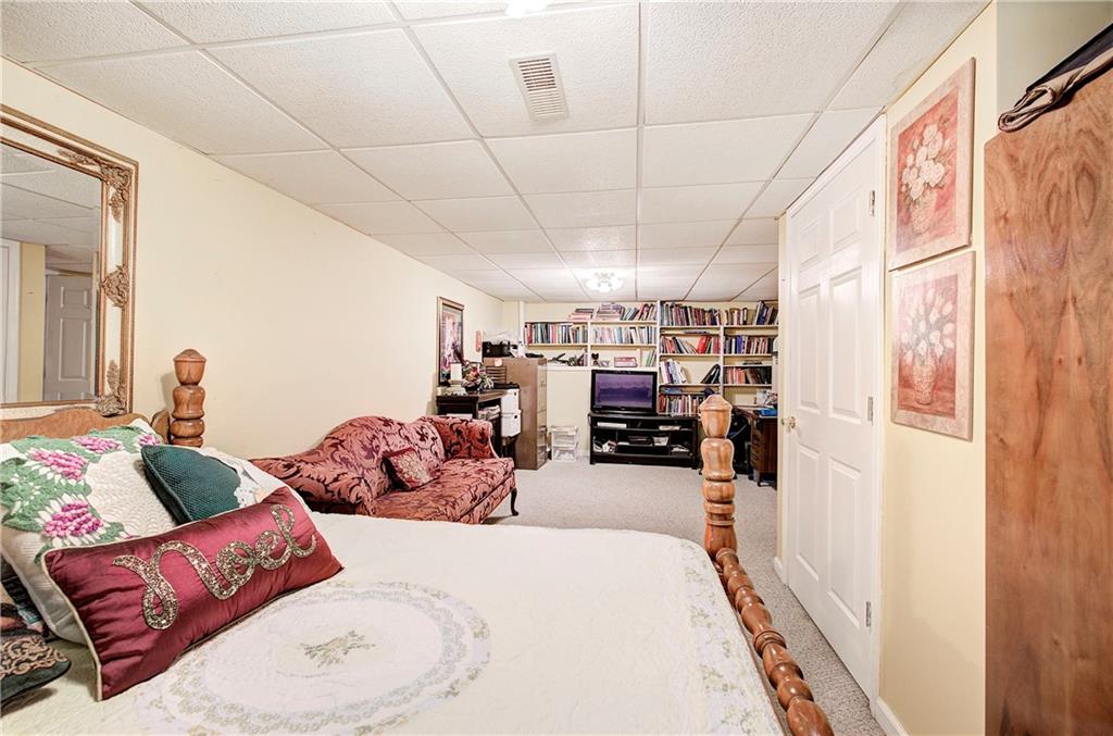218 Gilreath Road Southeast Cartersville, GA 30121 - Photo 21 of 27 a living room with furniture and a flat screen tv