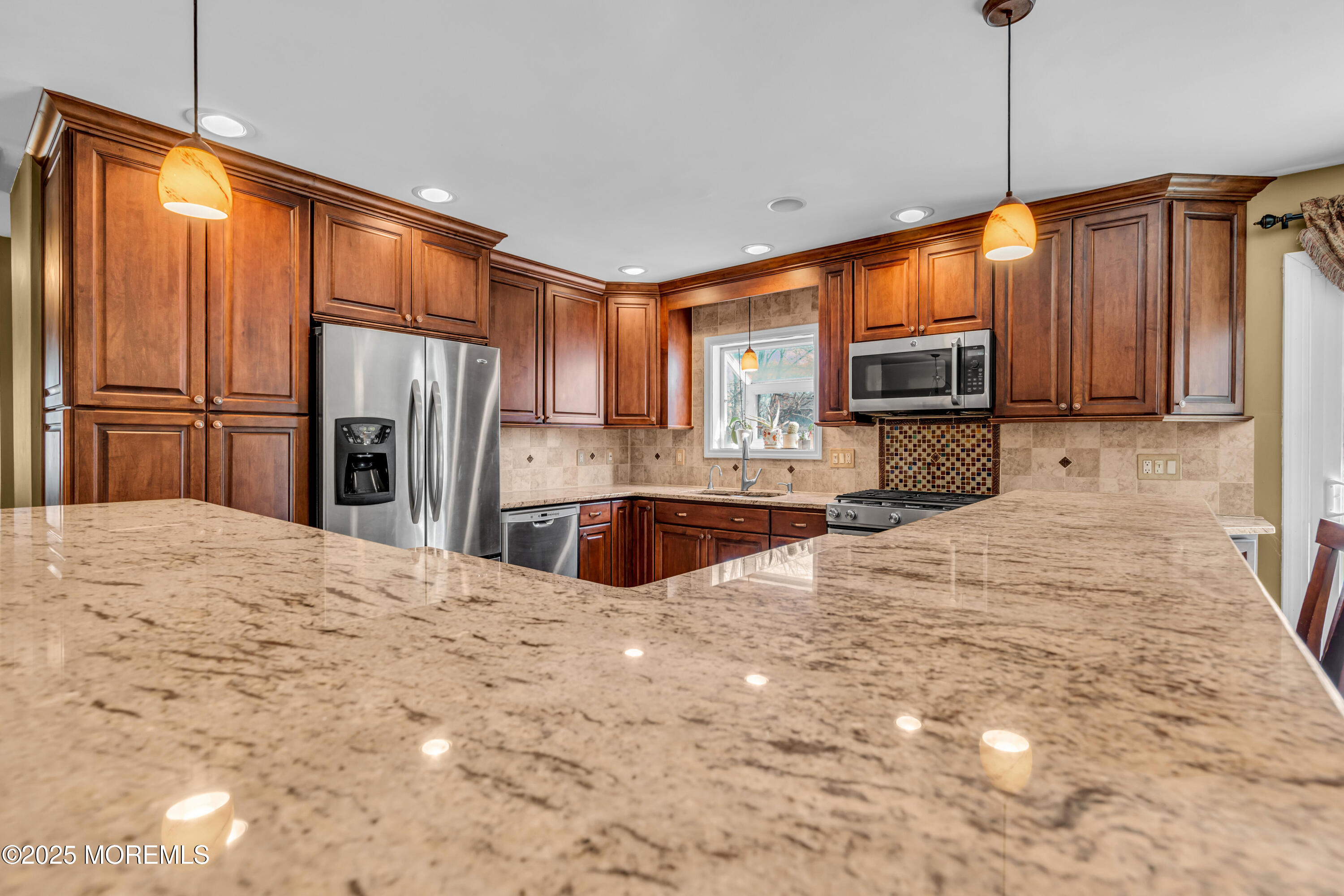 12 Windsor Road Howell, NJ 07731 - Photo 14 of 56 a kitchen with stainless steel appliances a refrigerator sink and cabinets