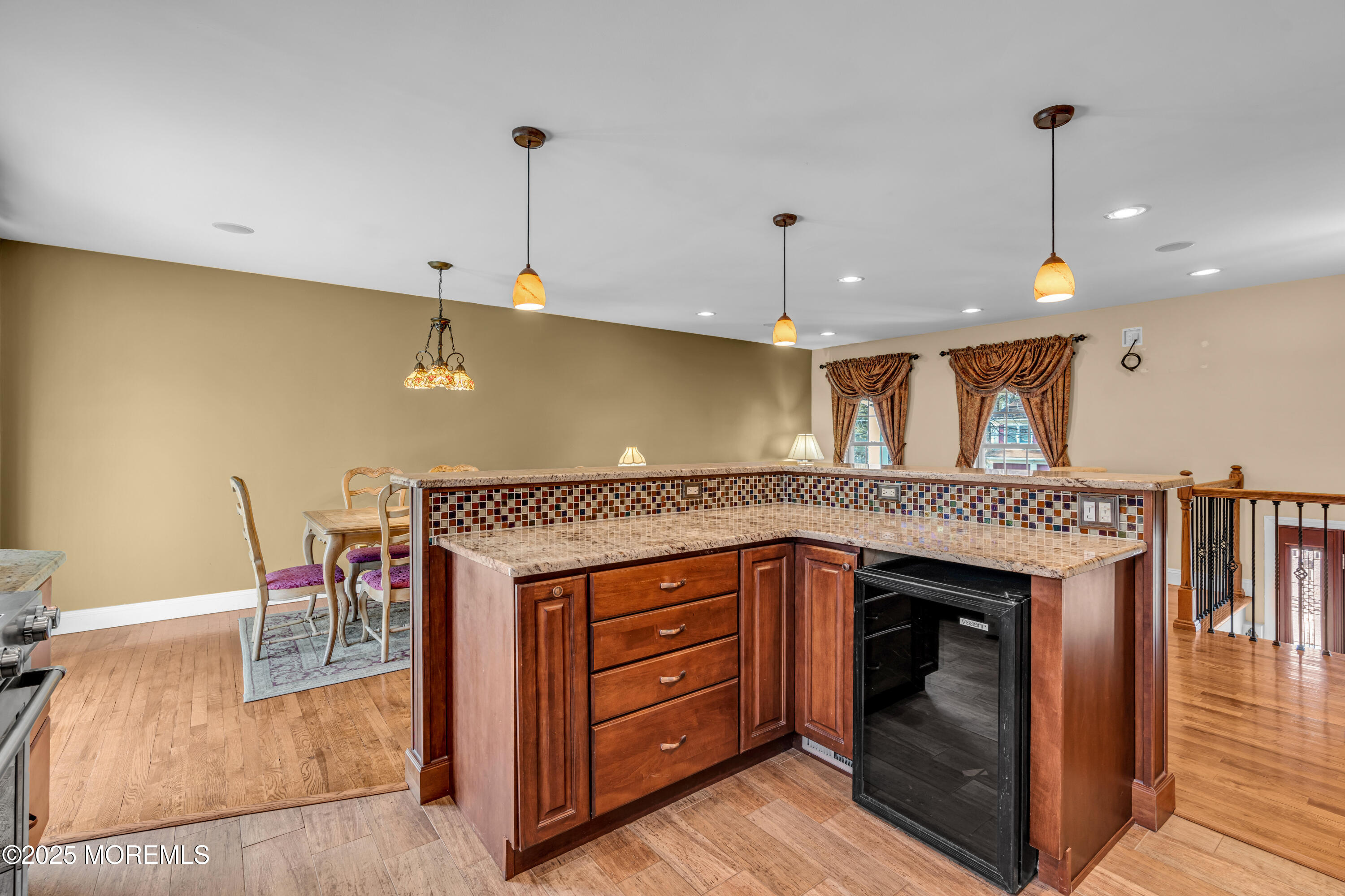 12 Windsor Road Howell, NJ 07731 - Photo 15 of 56 a kitchen with a stove a refrigerator and a fireplace