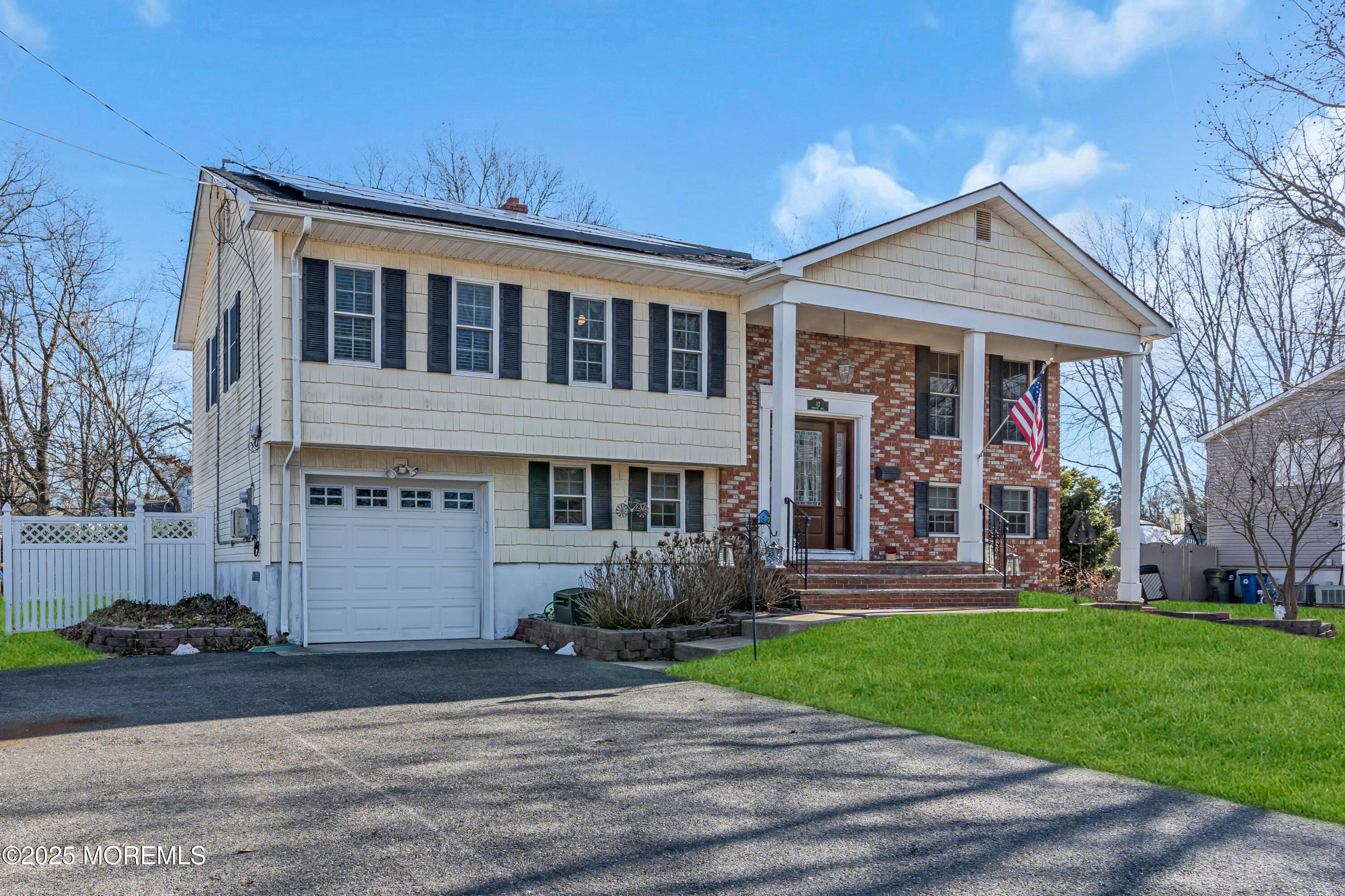 12 Windsor Road Howell, NJ 07731 - Photo 2 of 56 a front view of house with a garden