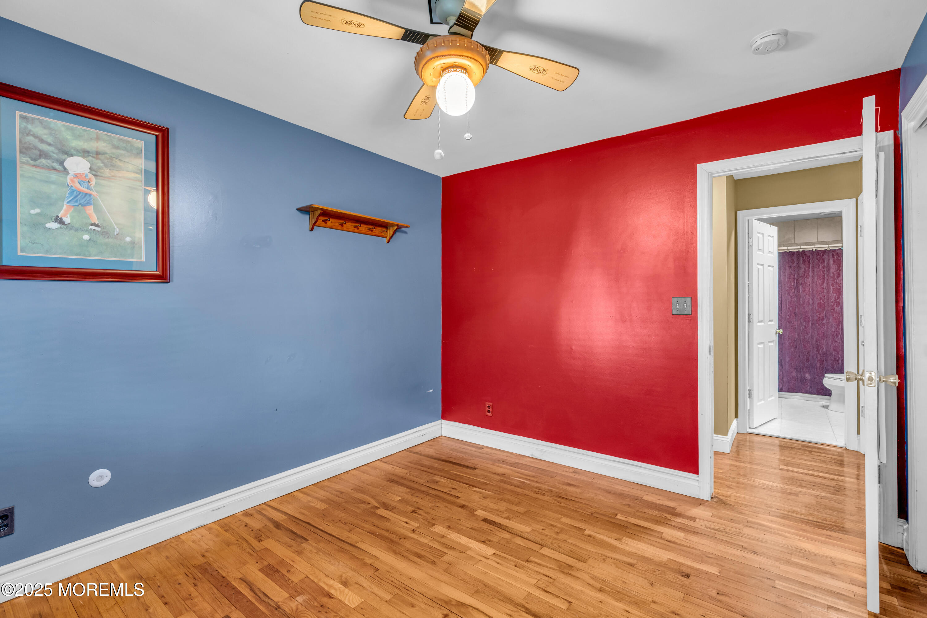 12 Windsor Road Howell, NJ 07731 - Photo 24 of 56 a view of an empty room with wooden floor