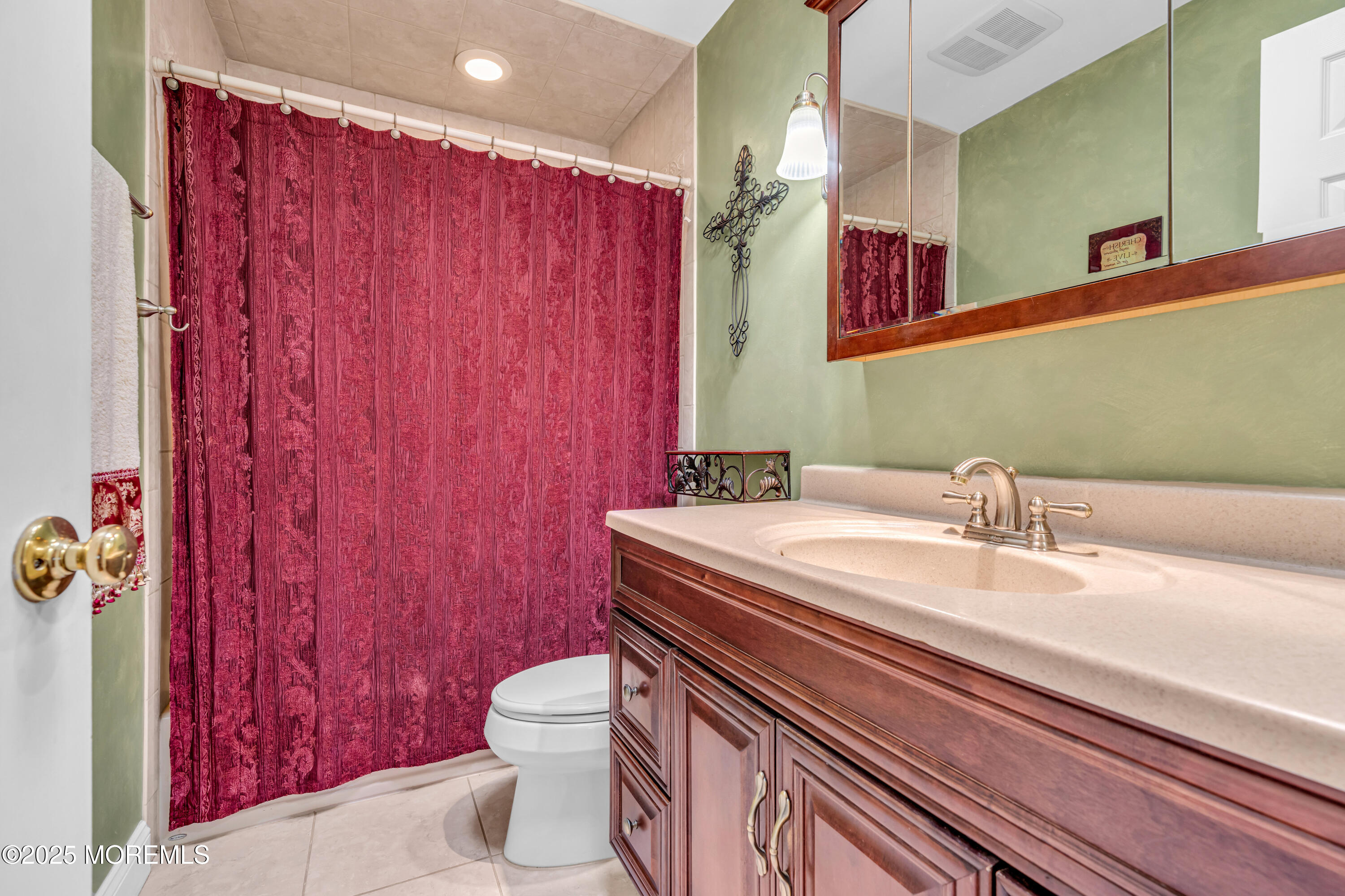 12 Windsor Road Howell, NJ 07731 - Photo 25 of 56 a bathroom with a sink a toilet and shower curtain