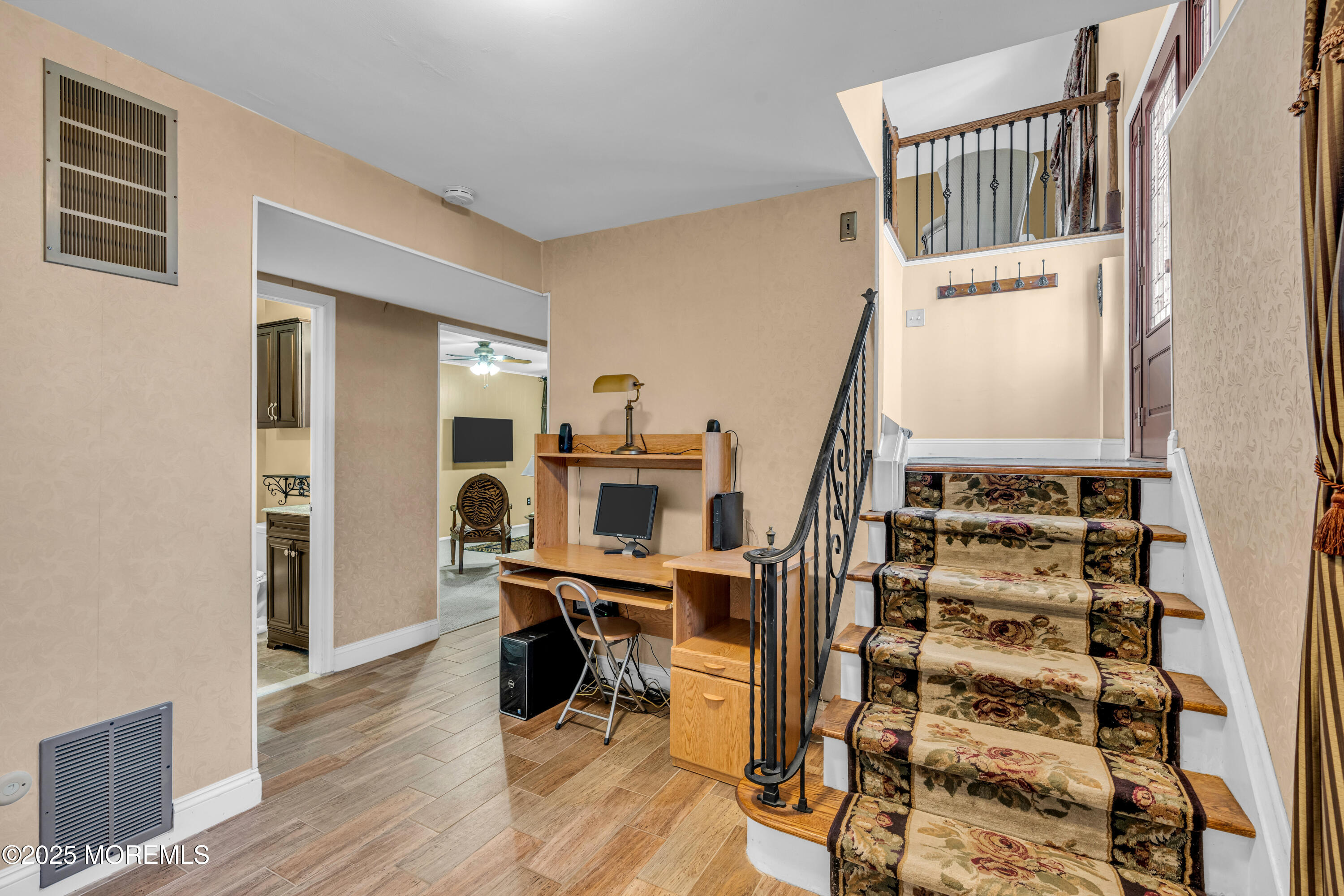 12 Windsor Road Howell, NJ 07731 - Photo 27 of 56 a view of a bedroom with wooden floor and stairs