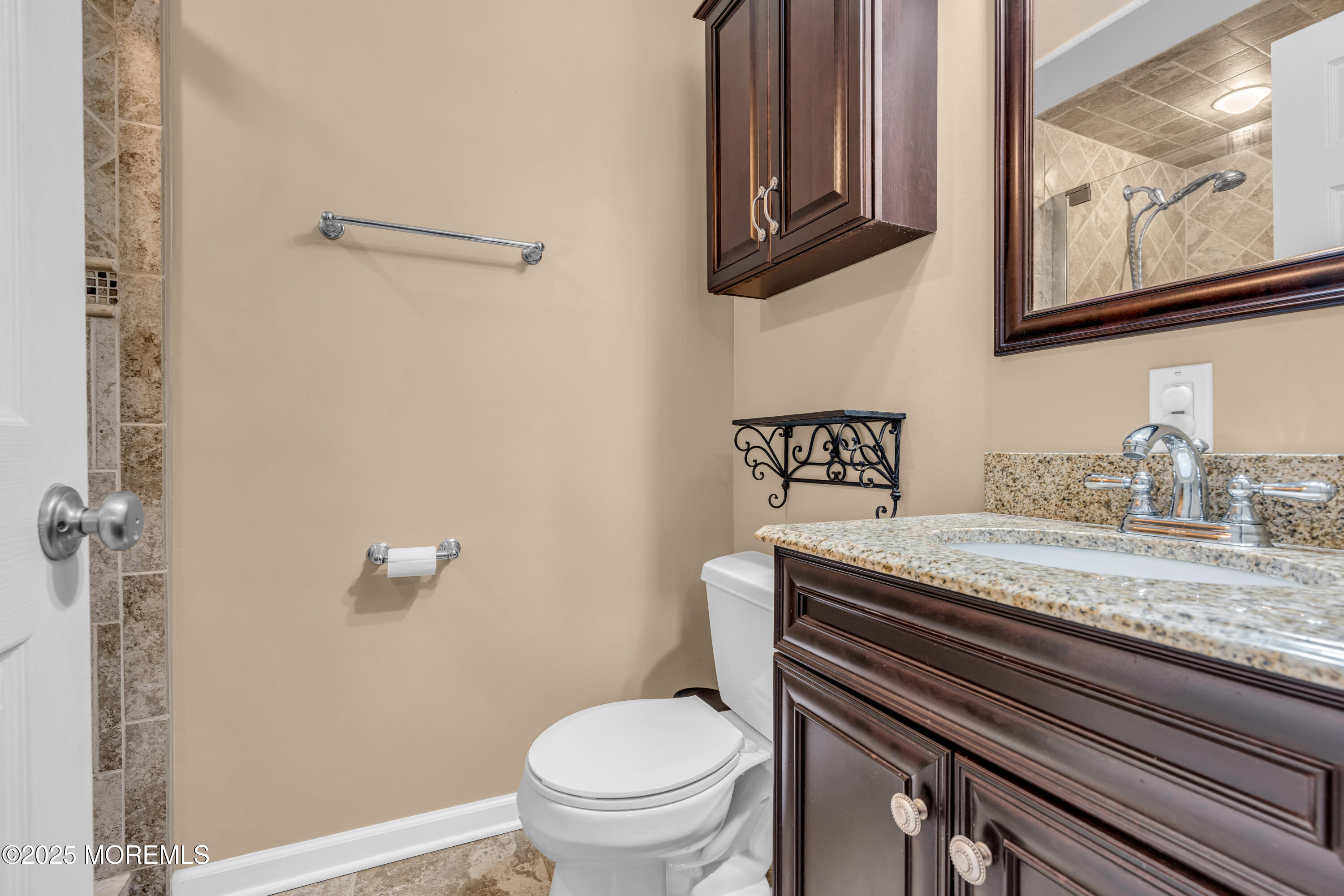 12 Windsor Road Howell, NJ 07731 - Photo 28 of 56 a bathroom with a granite countertop toilet sink and mirror