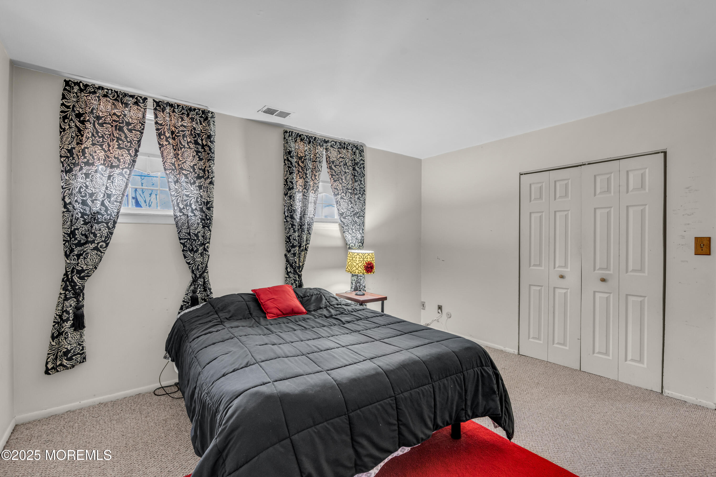 12 Windsor Road Howell, NJ 07731 - Photo 31 of 56 a bedroom with a bed and a window