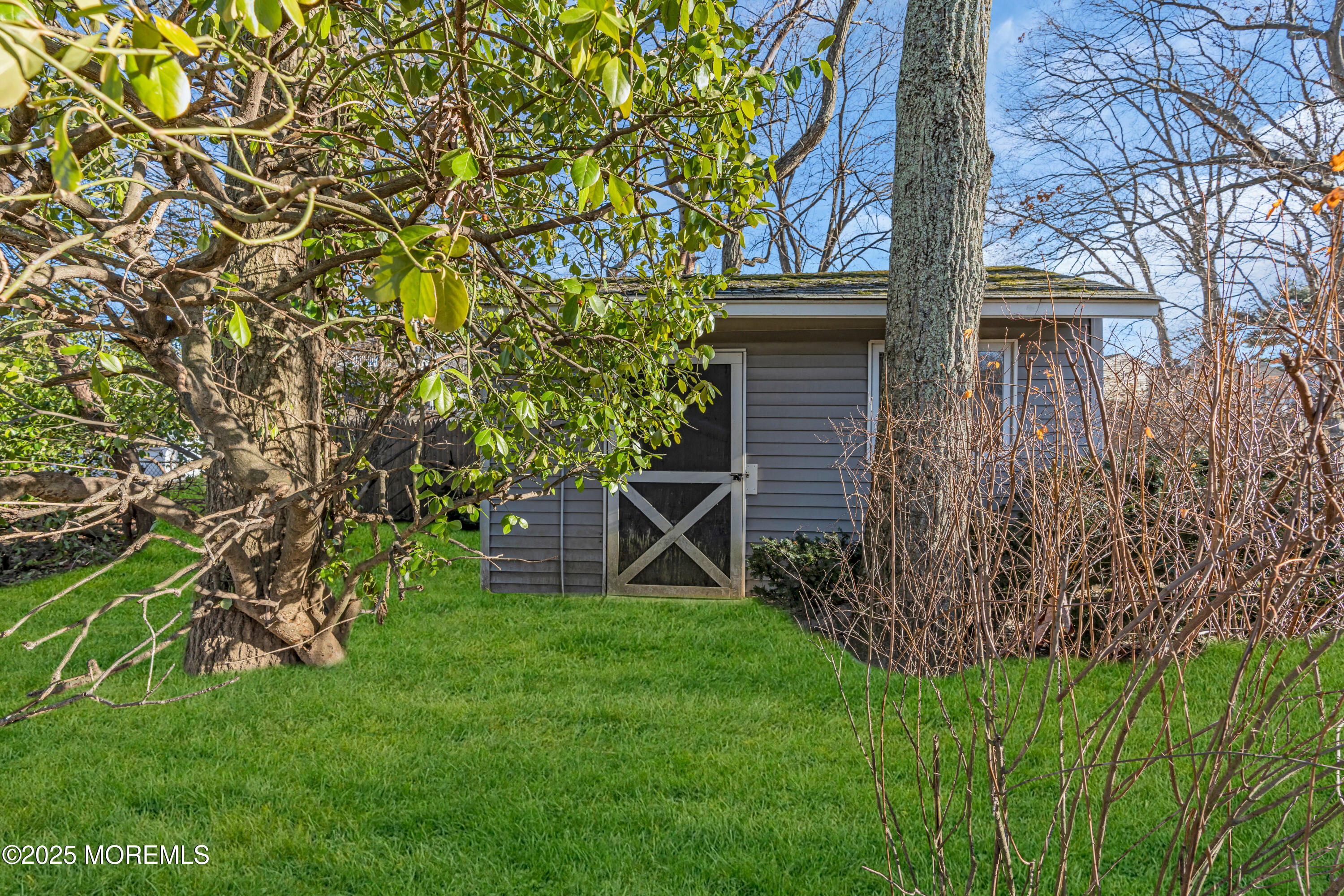 12 Windsor Road Howell, NJ 07731 - Photo 43 of 56 a backyard of a house with lots of green space