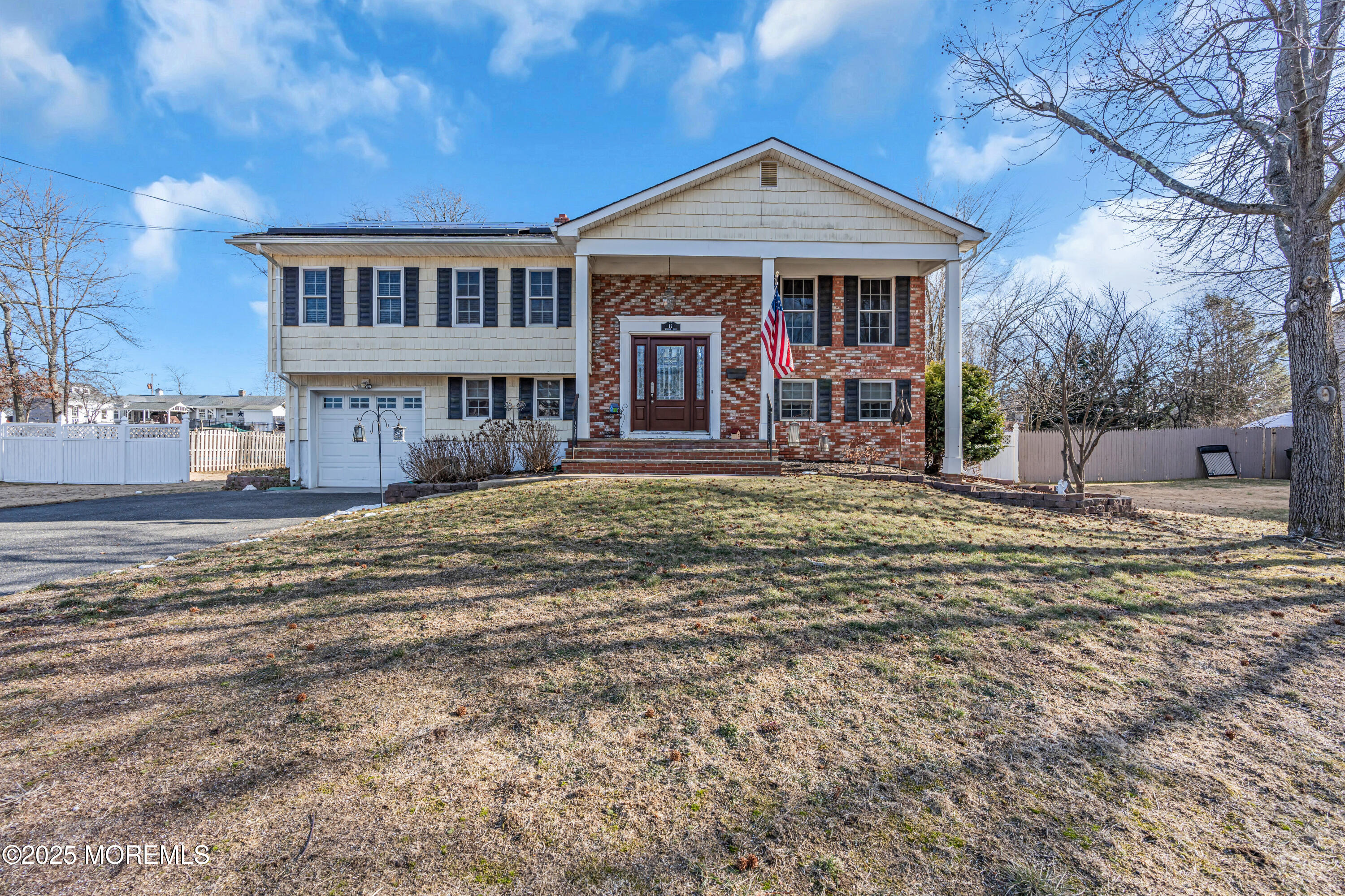12 Windsor Road Howell, NJ 07731 - Photo 45 of 56 a front view of a house with a yard