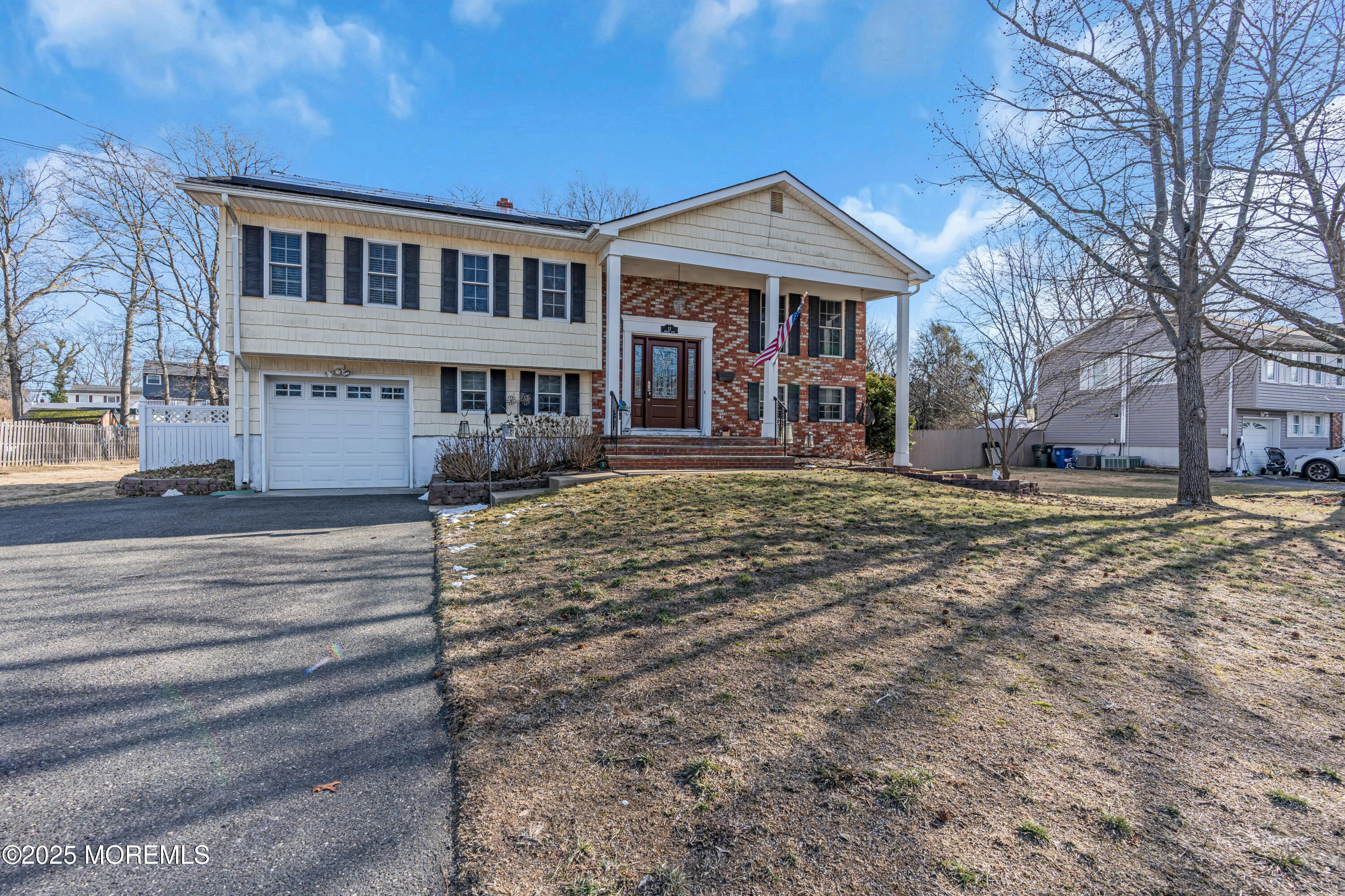 12 Windsor Road Howell, NJ 07731 - Photo 46 of 56 a front view of a house with a yard