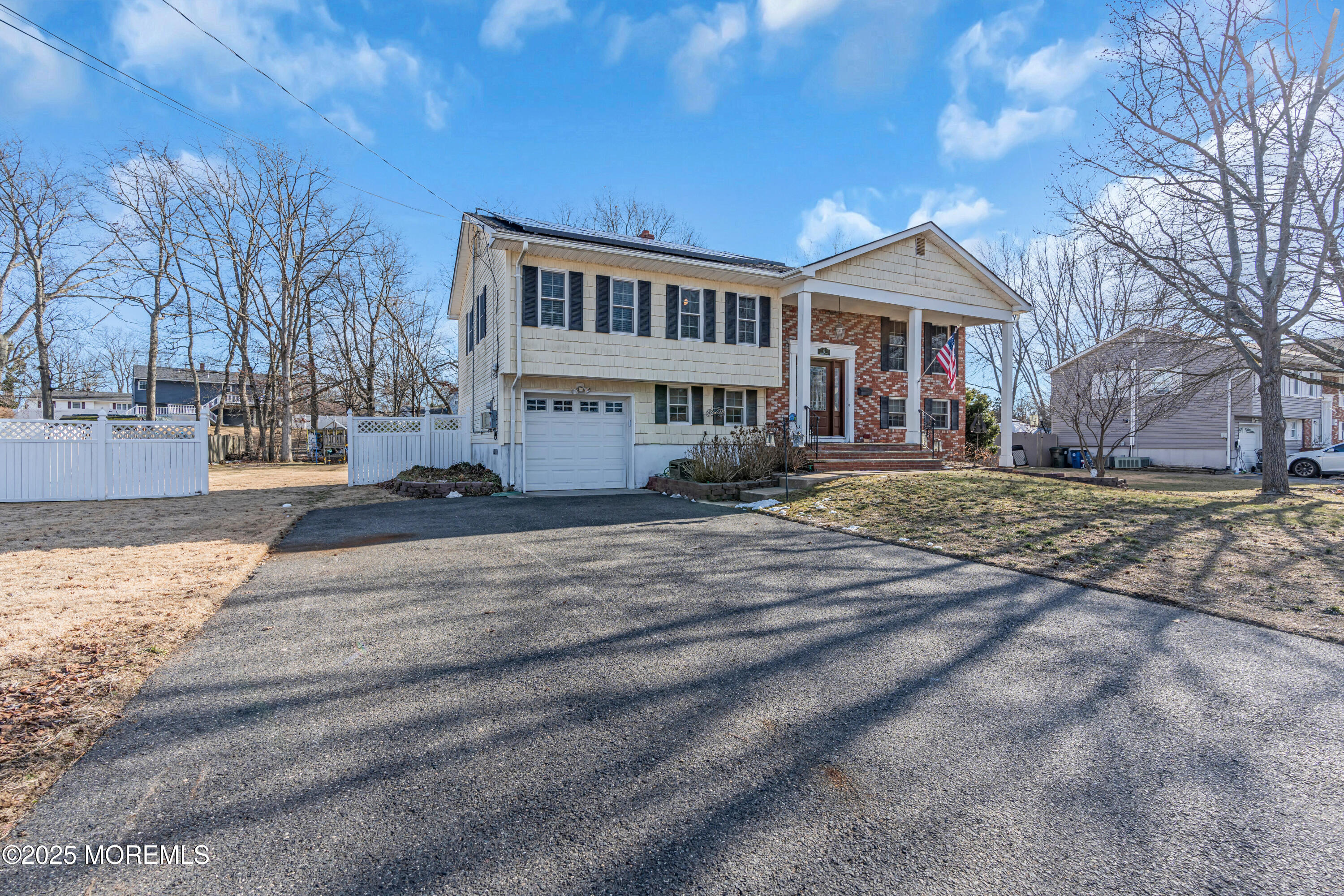 12 Windsor Road Howell, NJ 07731 - Photo 47 of 56 a front view of a house with a yard