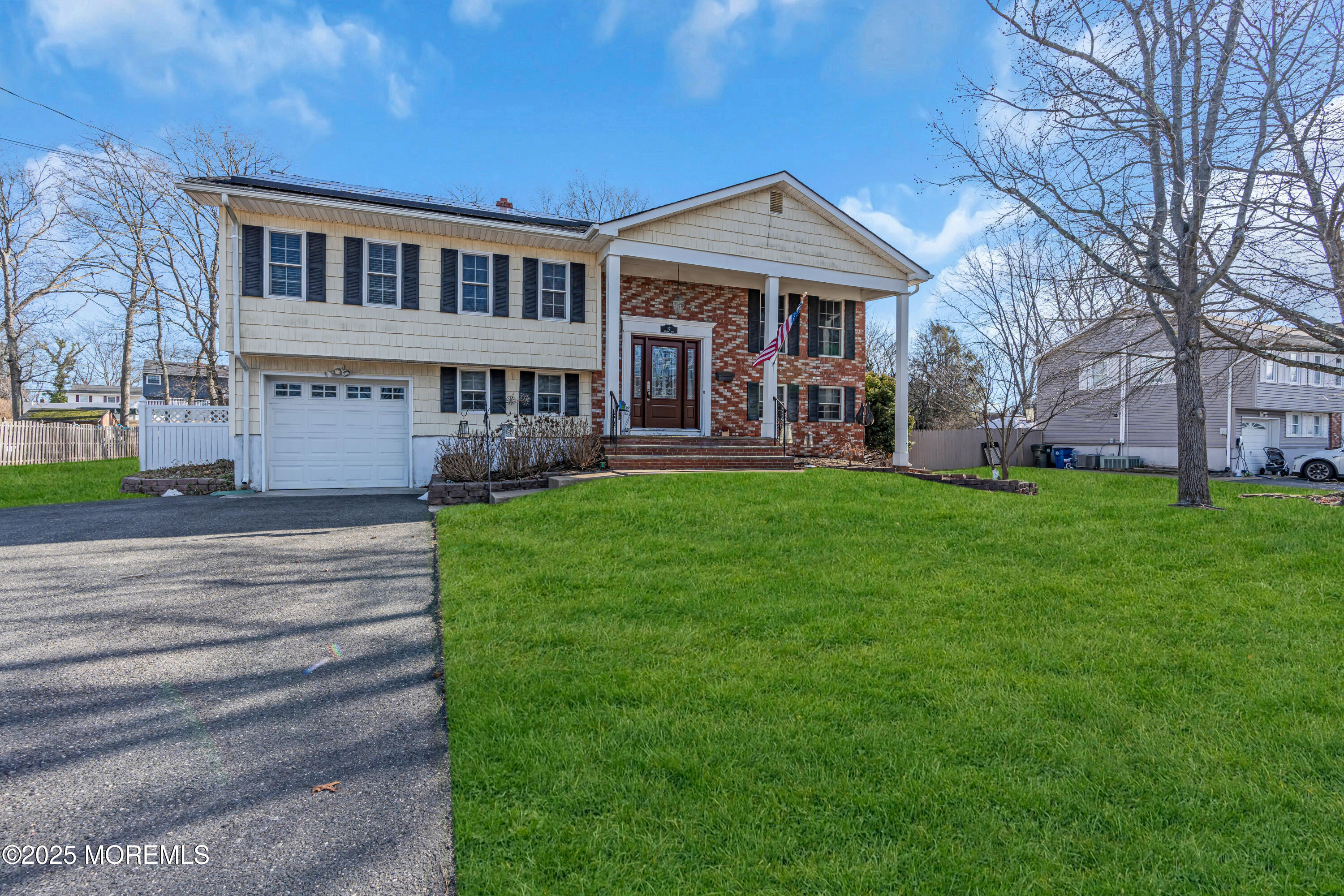 12 Windsor Road Howell, NJ 07731 - Photo 5 of 56 a front view of a house with a yard porch and outdoor seating