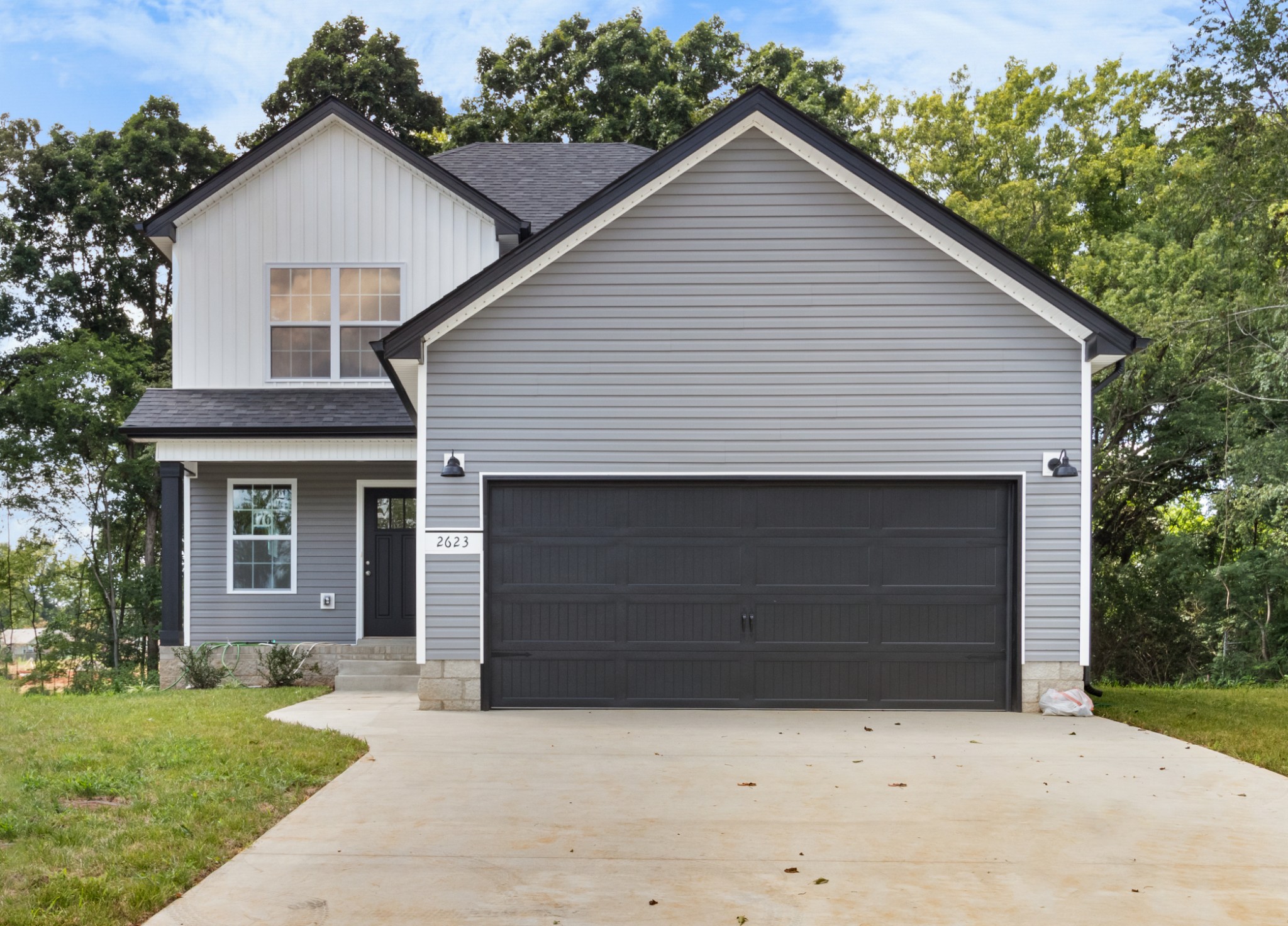 2623 Burch Road Clarksville, TN 37042 - Photo 1 of 30 a front view of a house with a yard and garage