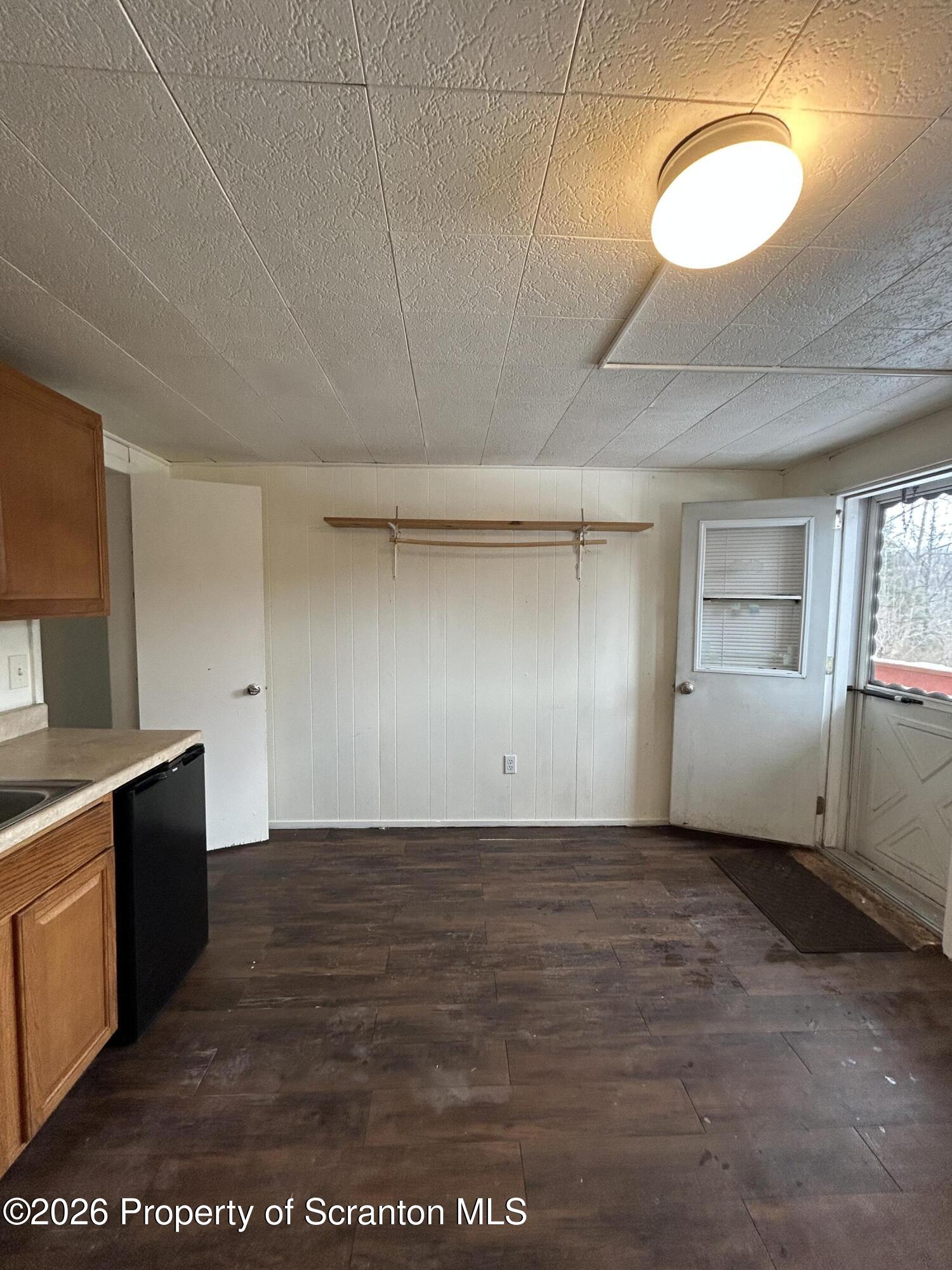 1393 1395 Old Trail Road, Unit A Clarks Summit, PA 18411 - Photo 3 of 8 a view of a kitchen with a sink and cabinets