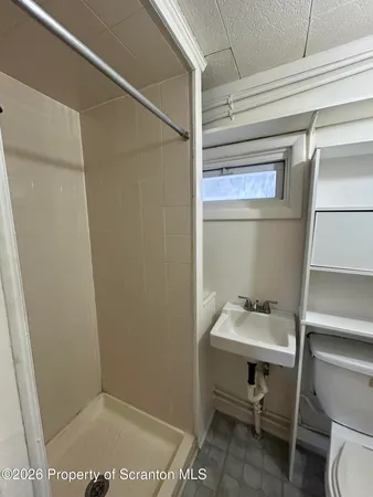 a bathroom with a sink and toilet