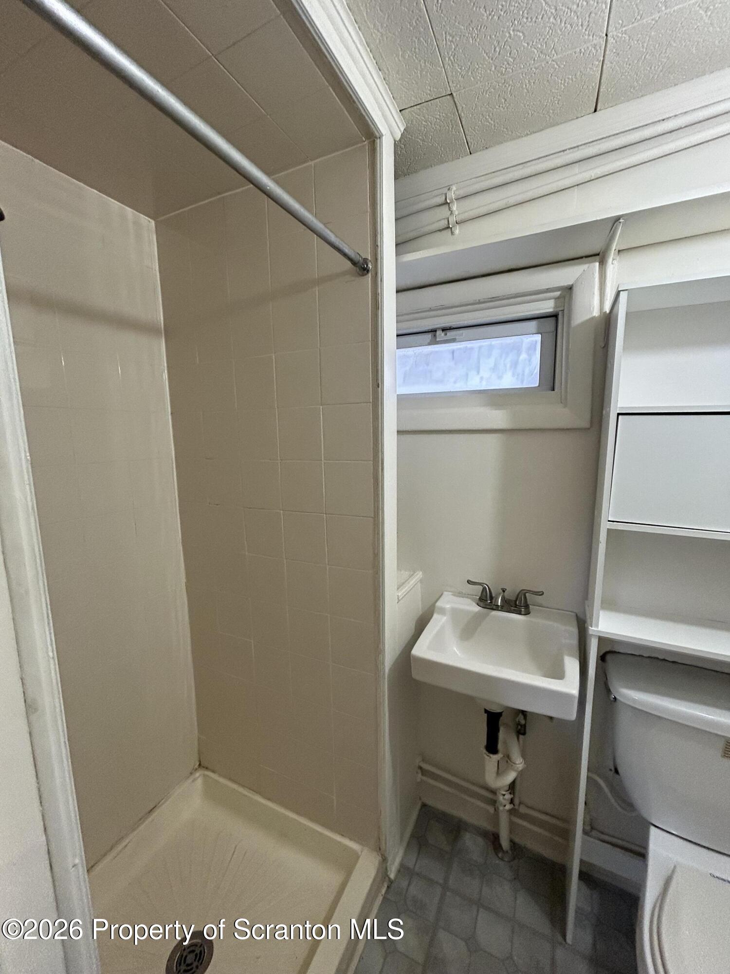 1393 1395 Old Trail Road, Unit A Clarks Summit, PA 18411 - Photo 7 of 8 a bathroom with a sink and toilet