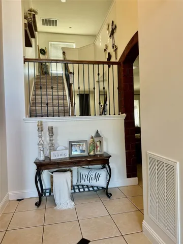 a view of a hallway with seating area and furniture
