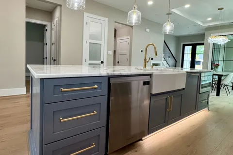 a kitchen with a sink and cabinets
