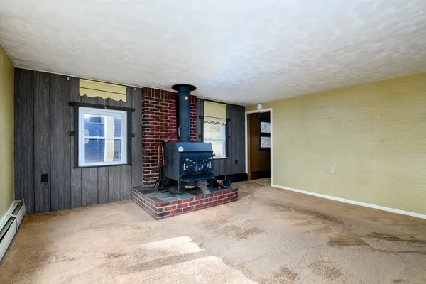 a view of livingroom with furniture and a window