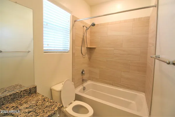 a bathroom with a shower and a bathtub