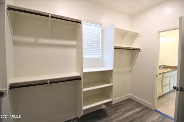 a kitchen with a refrigerator and a window
