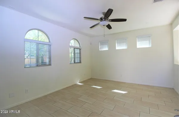a view of empty room with windows