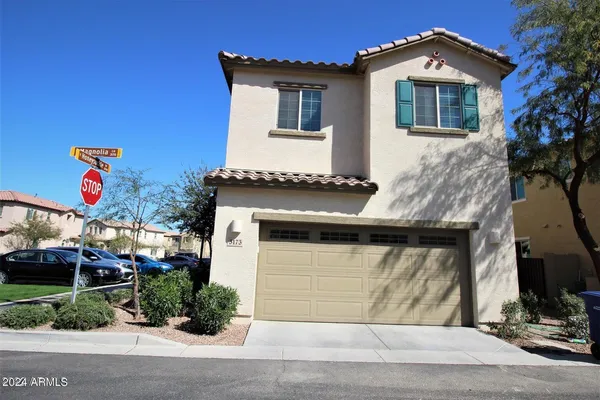 a front view of a house with garage