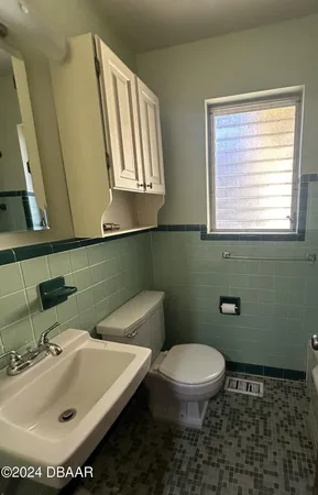 a bathroom with a sink and a toilet